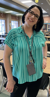 photo of a staff member wearing green to celebrate.